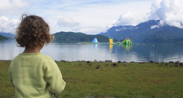 little girl standing in front of harrison hot springs