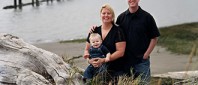 family at the river side on an overcast day